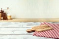 Empty wooden  table with cutting board over kitchen shelf background.  Interior mock up for design and product display Royalty Free Stock Photo