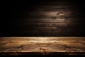 empty wooden table and dark background from behind Royalty Free Stock Photo