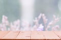 Empty wooden table on defocuced winter window background