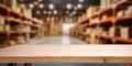 Empty wooden table on defocused blurred shelves in warehouse background Royalty Free Stock Photo