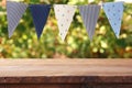 Empty wooden table with flags party background outdoors. for pro Royalty Free Stock Photo