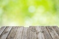 Empty wooden table with foliage bokeh Royalty Free Stock Photo