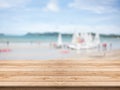 Empty wooden table in front with blurred background at the beach Royalty Free Stock Photo