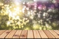 Empty wooden table on front blurred colorful bokeh background Royalty Free Stock Photo