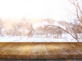 Empty wooden table in front of dreamy and magical winter landscape background. For product display montage. Royalty Free Stock Photo