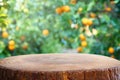 Empty wooden table in front of orange field