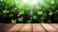 Empty wooden table mockup with defocused green and gold background, shamrock