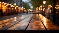 Empty wooden table outdoors. On a blurred background cafes and restaurants