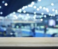 Empty wooden table over defocused light and shadow of shopping m Royalty Free Stock Photo