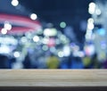 Empty wooden table over defocused light and shadow of shopping m Royalty Free Stock Photo