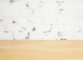 Empty wooden table over grunge cement wall Royalty Free Stock Photo