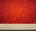 Empty wooden table over red blur light, Christmas background Royalty Free Stock Photo