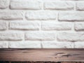 Empty wooden table over white brick wall. Background for product montage display Royalty Free Stock Photo