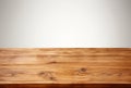 Empty wooden table over white wall background, for product display montage Royalty Free Stock Photo