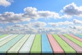 Empty wooden table or plank with blue sky and cloud background. Royalty Free Stock Photo