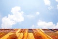Empty wooden table or plank with blue sky and cloud background. Royalty Free Stock Photo