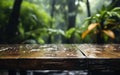 Empty wooden table in the rainy tropical forest with blurred background