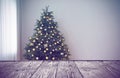 Empty wooden table in room with beautiful Christmas tree. Space for design Royalty Free Stock Photo