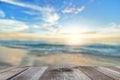 Empty wooden table with sea, sand beach and beautiful sunrise Royalty Free Stock Photo