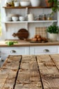 Empty wooden table set against a softly blurred kitchen counter for perfect background composition Royalty Free Stock Photo