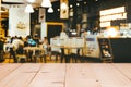 Empty wooden table space platform and blurred restaurant or coffee shop background. Royalty Free Stock Photo