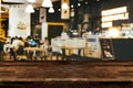 Empty wooden table space platform and blurred restaurant or coffee shop. Royalty Free Stock Photo