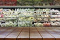 Empty wooden table space platform and blurred Supermarket aisle Royalty Free Stock Photo