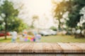 Empty wooden table top and Abstract blurred light bokeh and blur background of garden trees in sunlight. product display template Royalty Free Stock Photo