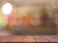 Empty wooden table top with abstract blurred lighting background Royalty Free Stock Photo