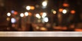 Empty wooden table top with blur coffee shop or restaurant interior background, Panoramic banner. Royalty Free Stock Photo