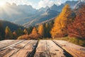 Empty wooden table top on blurred background of autumn colorful landscape in Dolomites - for display of your products Royalty Free Stock Photo