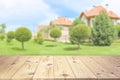 Empty wooden table top on blurred country house background mock up for design and product display