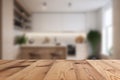 Empty wooden table top and blurred kitchen, dining room interior on the background. Copy space for your object, product Royalty Free Stock Photo