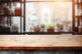 Empty wooden table top and blurred kitchen interior on the background. Copy space for your object, product, food Royalty Free Stock Photo