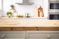 Empty wooden table top on blurred kitchen interior background. Royalty Free Stock Photo