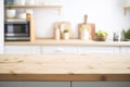 Empty wooden table top on blurred kitchen interior background. Royalty Free Stock Photo