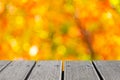 Empty wooden table top with colorful color of garden bokeh for creating Royalty Free Stock Photo