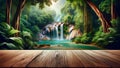 empty wooden table top foregrounds jungle landscape, complete with waterfall