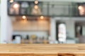 Empty wooden table top with lights bokeh on blur restaurant background of cafe, coffee shop, bar, background Royalty Free Stock Photo