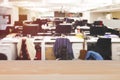 Empty wooden table top  with modern office, open space to work thought the window and background city Royalty Free Stock Photo