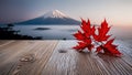 Empty wooden table top with Mountain Fuji with morning fog and red leaves background blurred