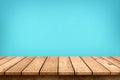 Empty wooden table top on pastel blue colour background, used for display or montage your products