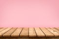 Empty wooden table top on pastel pink colour background, used for display or montage your products Royalty Free Stock Photo