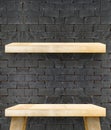 Empty Wooden Table top and shelf at black bricks wall,Template m Royalty Free Stock Photo