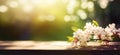 Empty wooden table top, texture board, on a blurred background of an orchard, trees in blurred bokeh