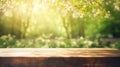 Empty wooden table top, texture board, on a blurred background of an orchard, trees in blurred bokeh