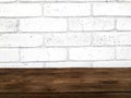 Empty wooden table on white bricks wall background. Royalty Free Stock Photo