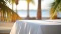 Empty wooden table with white tablecloth for product display on sea beach blurred background. Ai generative