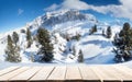 Empty wooden table and winter mountains background. Alps, Italy, Val di fassa
