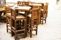 Empty Wooden tables and chairs in a cafe on the street in Prague, Czech Republic Royalty Free Stock Photo